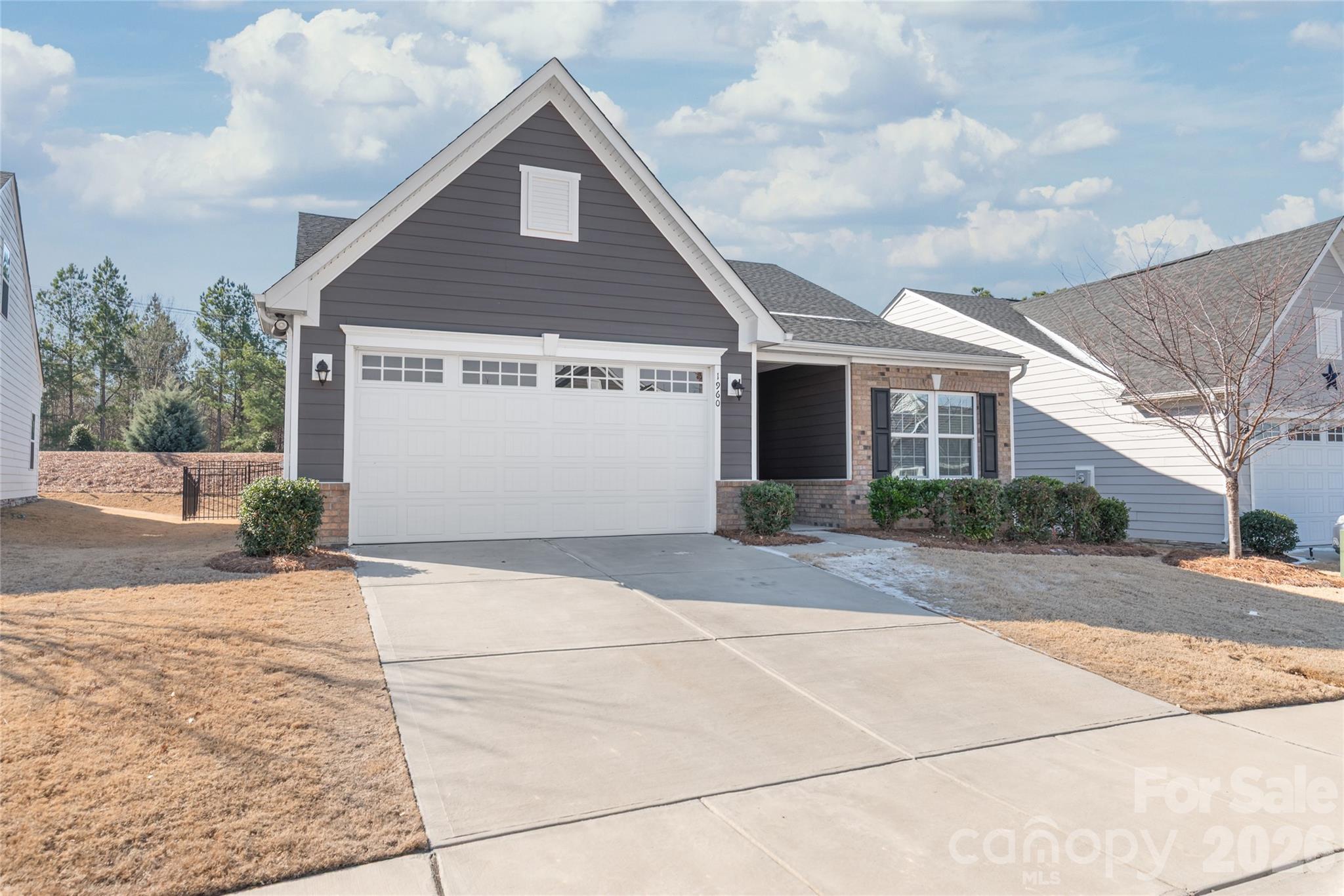 1960 Slippery Rock Lane Monroe, NC 28112 - Photo 3 of 32 a front view of a house with a yard and garage