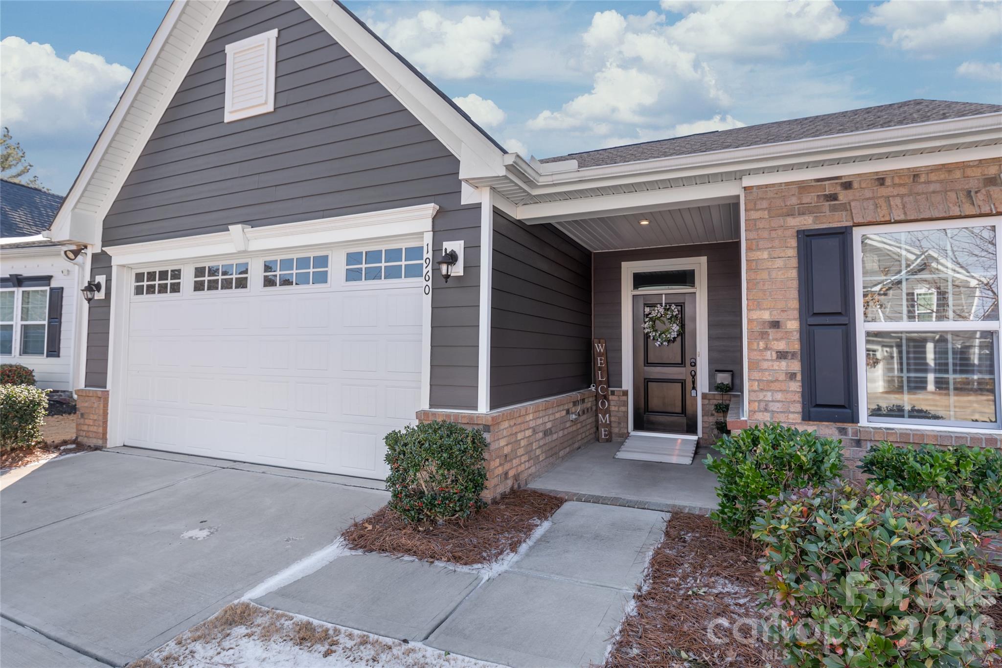 1960 Slippery Rock Lane Monroe, NC 28112 - Photo 4 of 32 a front view of a house with garden