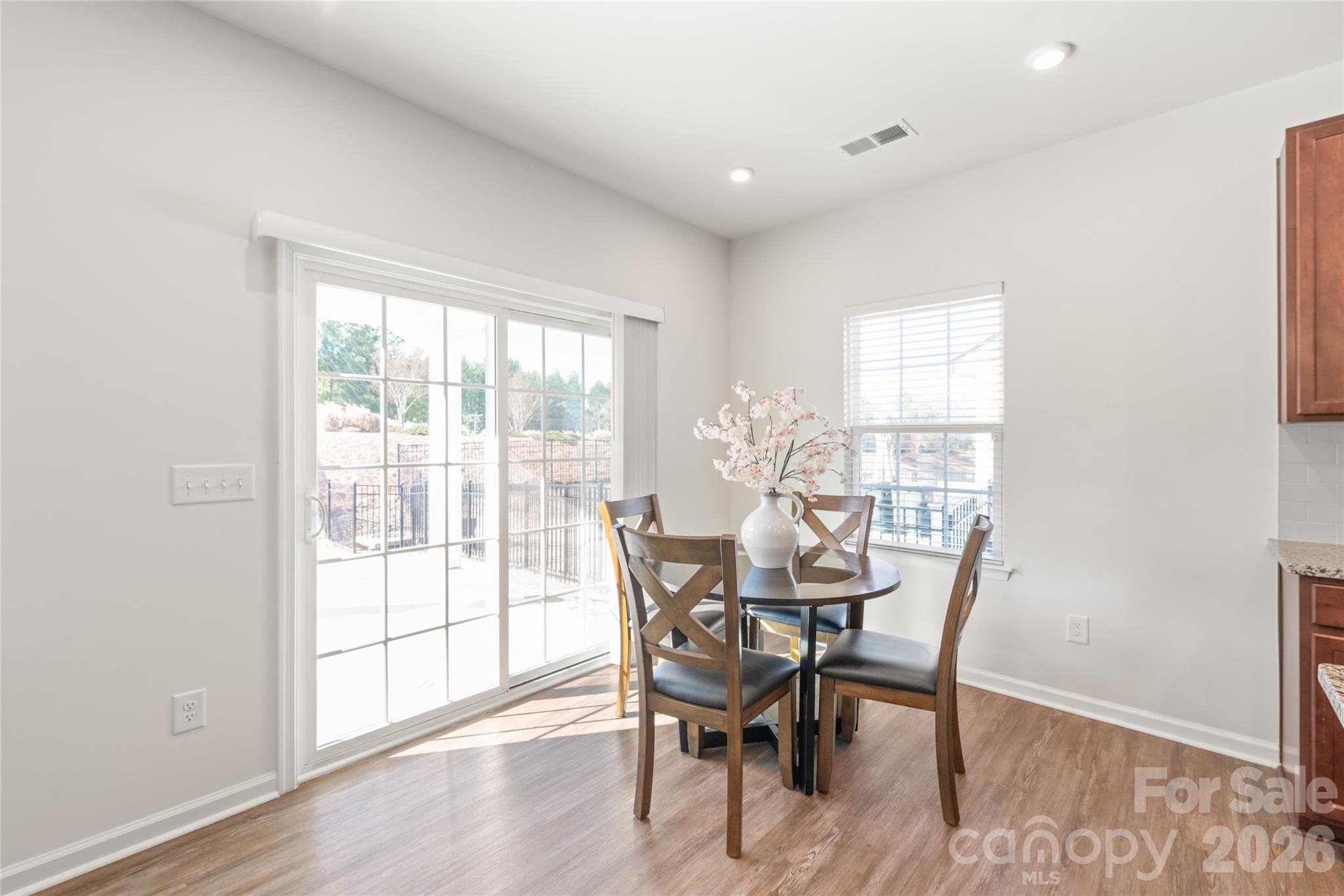1960 Slippery Rock Lane Monroe, NC 28112 - Photo 10 of 32 a view of a dining room with furniture and wooden floor