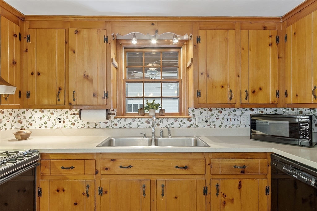 54 Kemp Street Groton, MA 01450 - Photo 11 of 38 a bathroom with a sink and a mirror