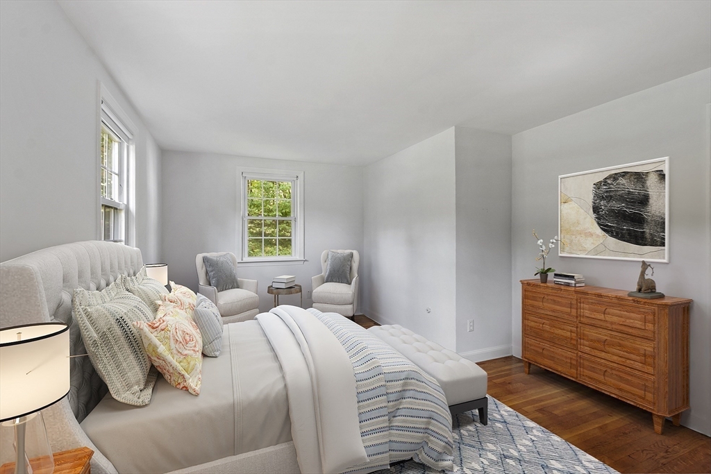54 Kemp Street Groton, MA 01450 - Photo 12 of 38 a bedroom with a bed and wooden floor