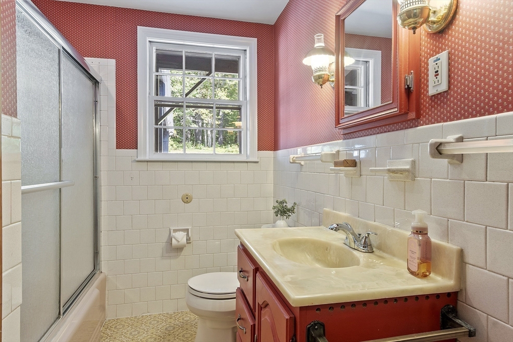 54 Kemp Street Groton, MA 01450 - Photo 16 of 38 a bathroom with a sink and a mirror