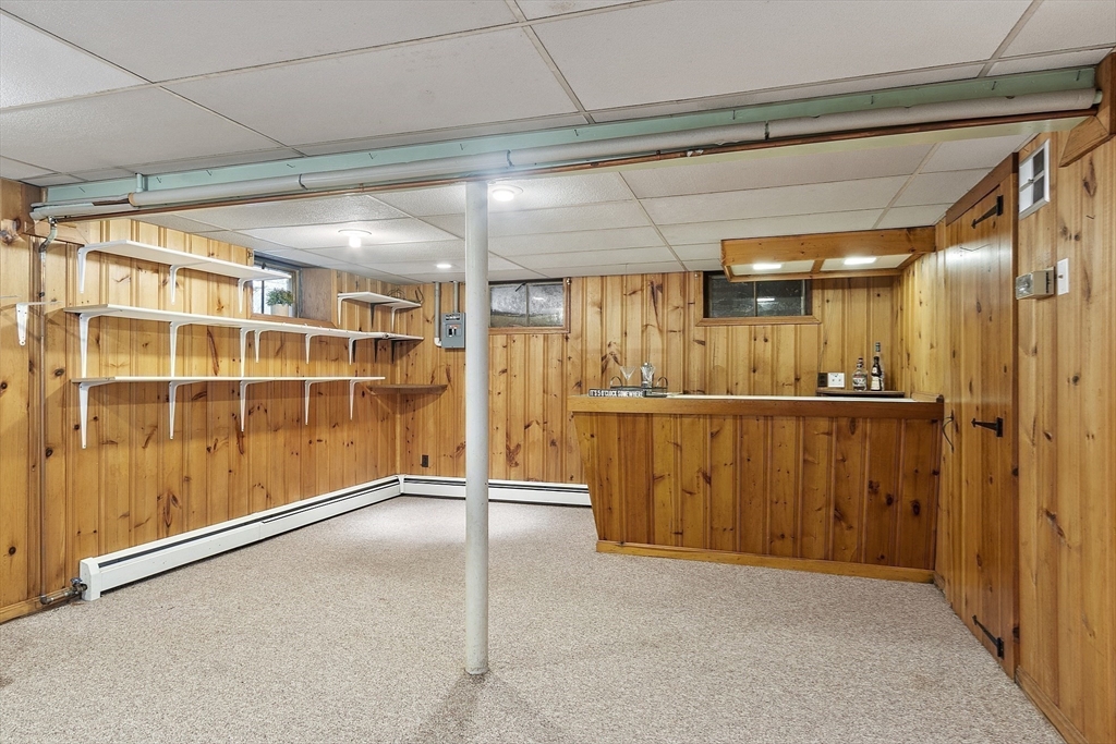 54 Kemp Street Groton, MA 01450 - Photo 23 of 38 a view of a hallway with wooden walls