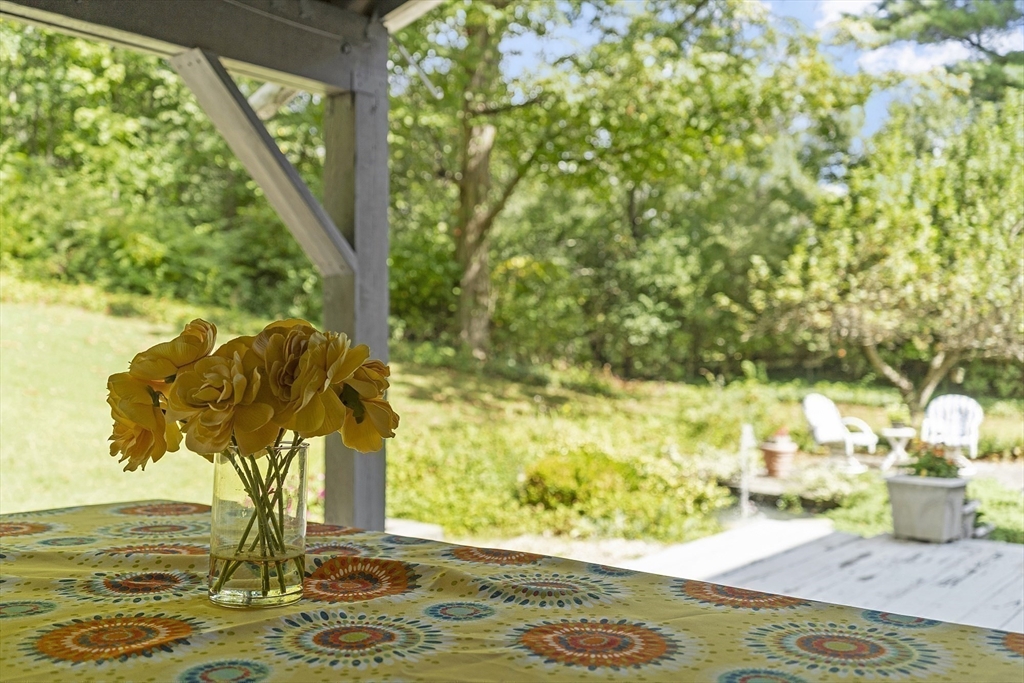 54 Kemp Street Groton, MA 01450 - Photo 30 of 38 a vase of flowers sitting on a table
