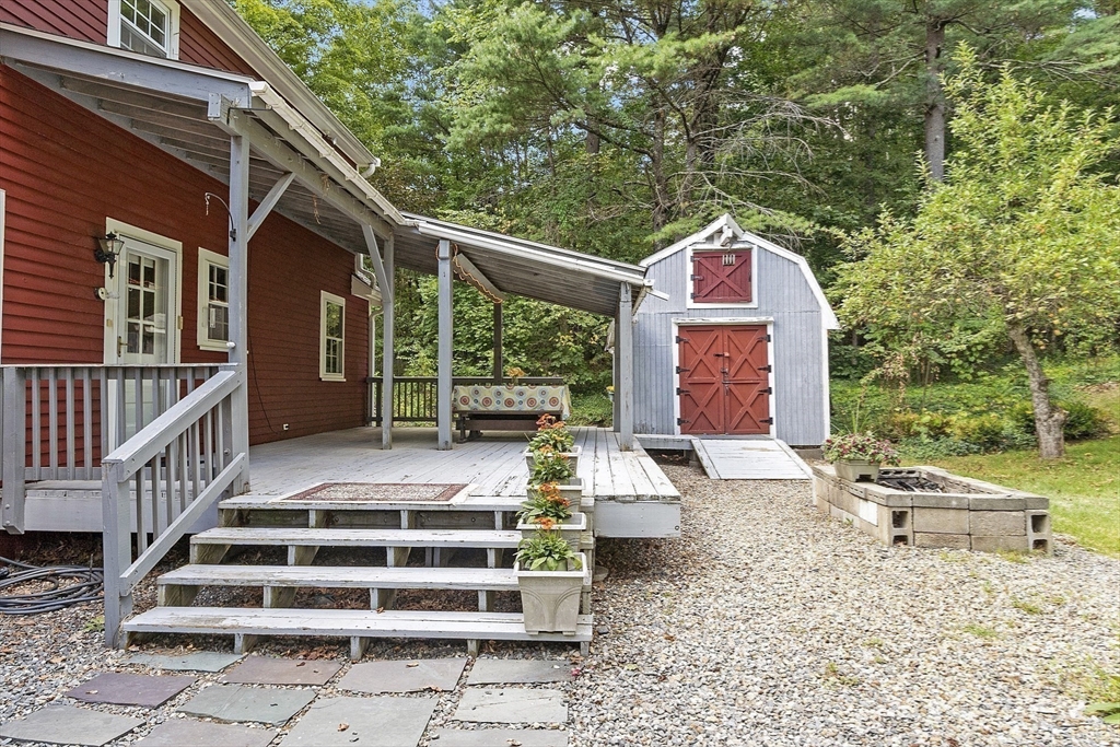 54 Kemp Street Groton, MA 01450 - Photo 31 of 38 a front view of a house with a yard