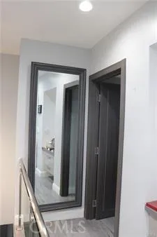 a view of a hallway to a livingroom and a hallway