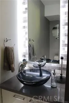 a view of a hallway with wooden floor and a glass door