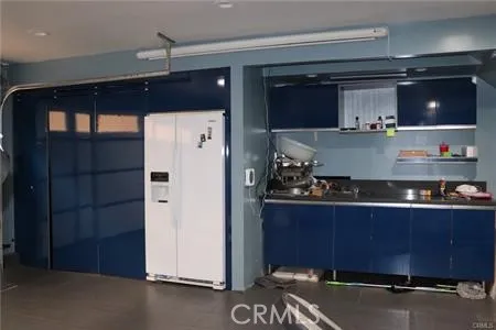 a kitchen with a stove and cabinets