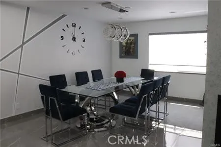 a view of a dining room with furniture and window