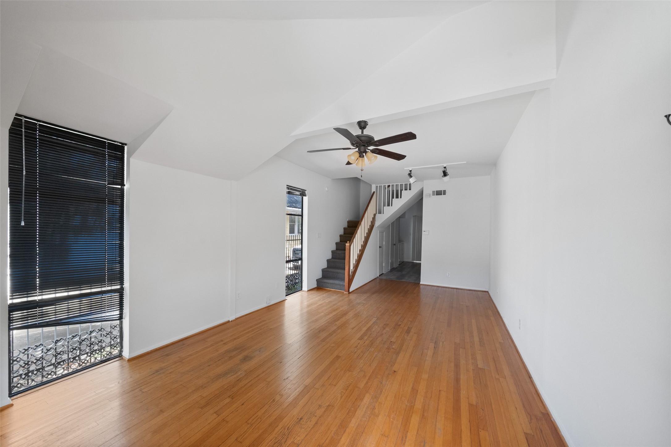 518 Hawthorne Street, Unit 2 Houston, TX 77006 - Photo 4 of 15 a view of a hallway with wooden floor and staircase