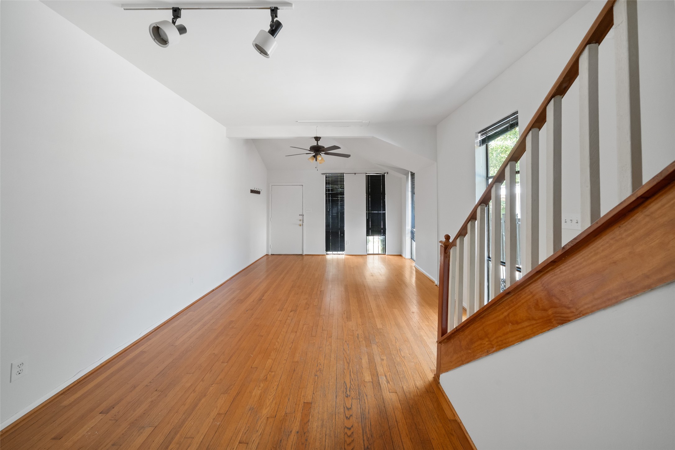 518 Hawthorne Street, Unit 2 Houston, TX 77006 - Photo 7 of 15 a view of a hallway view with wooden floor and staircase