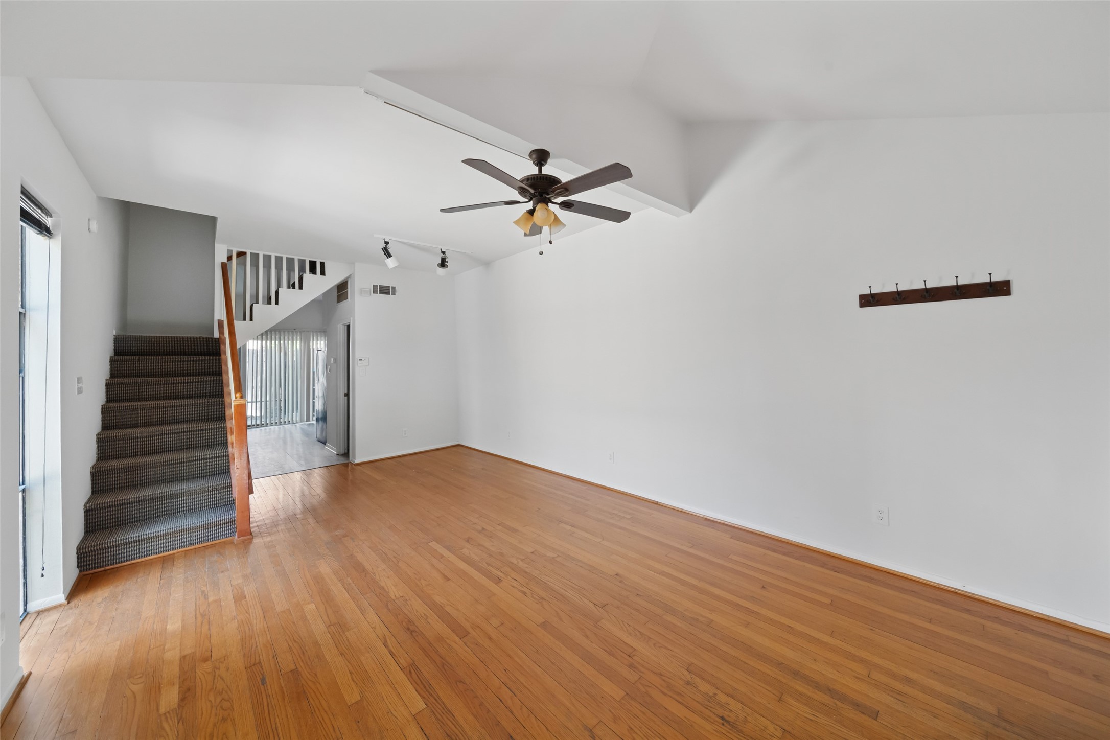 518 Hawthorne Street, Unit 2 Houston, TX 77006 - Photo 10 of 15 wooden floor in an empty room with a window