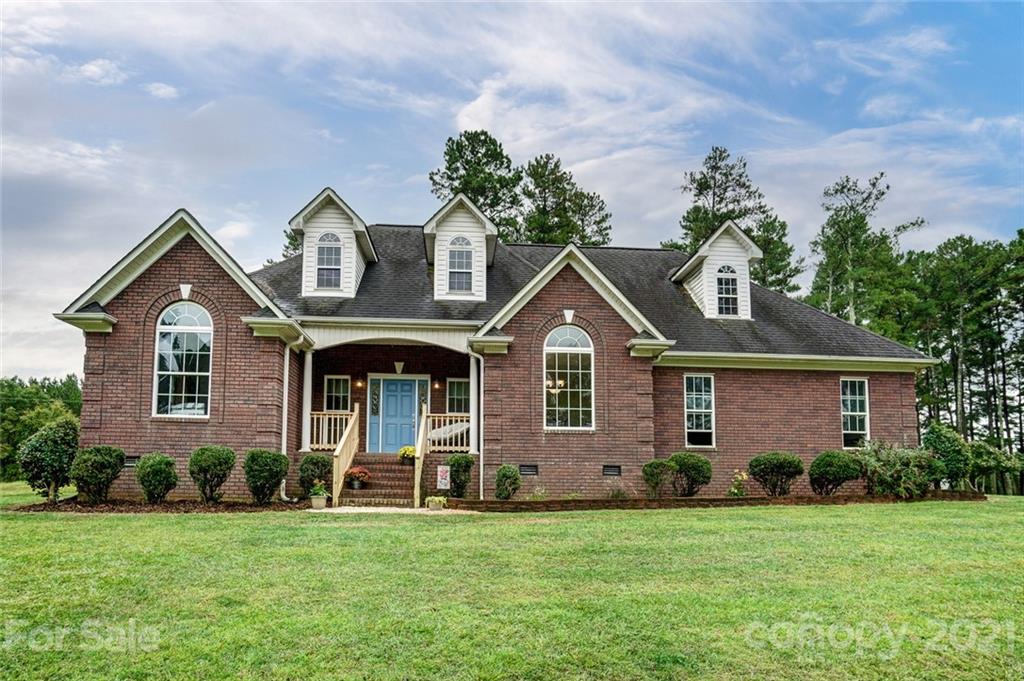9180 Meadowood Road Mount Pleasant, NC 28124 - Photo 1 of 37 a front view of a house with a yard