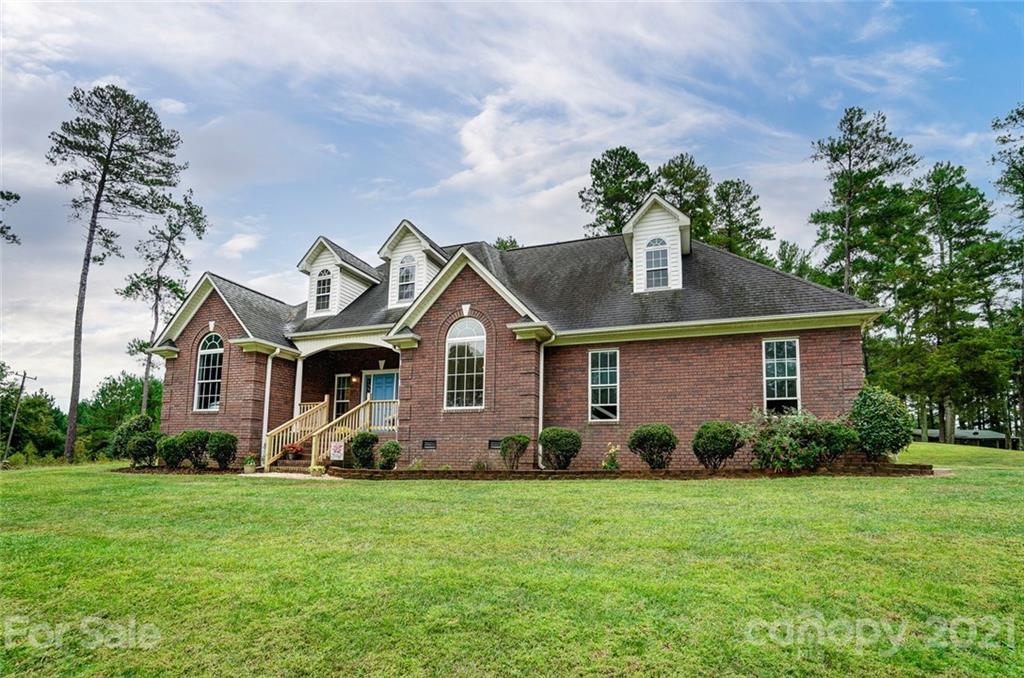 9180 Meadowood Road Mount Pleasant, NC 28124 - Photo 2 of 37 a front view of house with yard and green space
