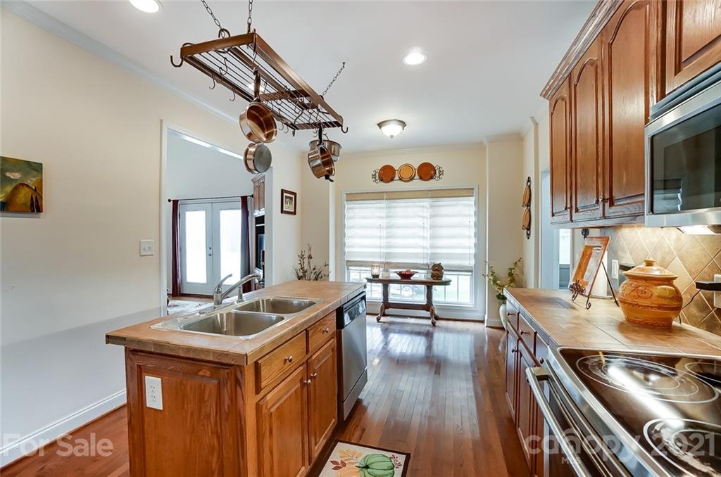 9180 Meadowood Road Mount Pleasant, NC 28124 - Photo 15 of 37 a kitchen with sink stove and cabinets