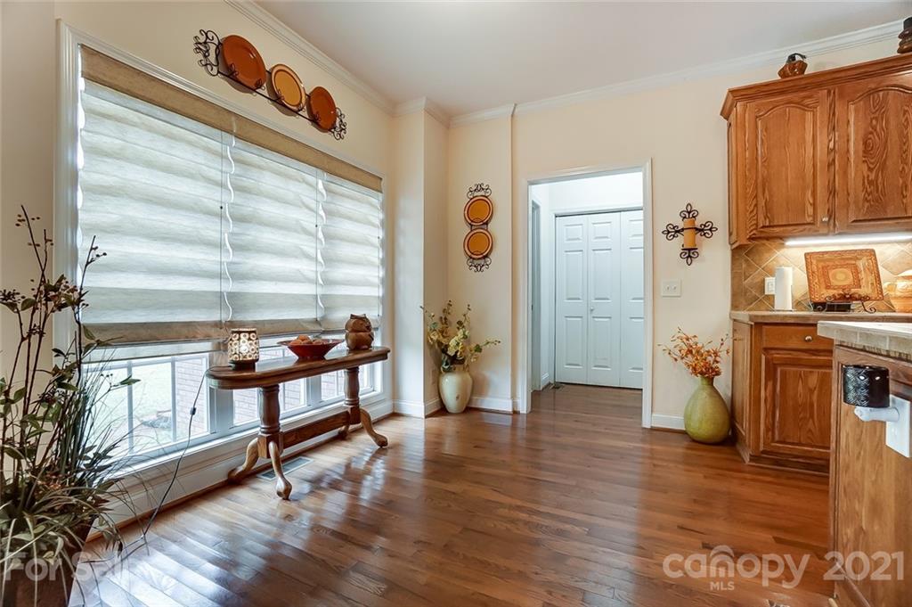 9180 Meadowood Road Mount Pleasant, NC 28124 - Photo 17 of 37 a view of a hallway with wooden floor and staircase