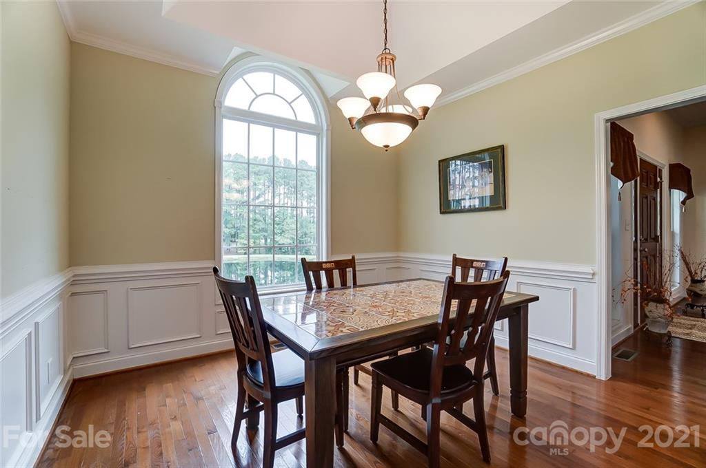 9180 Meadowood Road Mount Pleasant, NC 28124 - Photo 19 of 37 a view of a dining room with furniture window and wooden floor