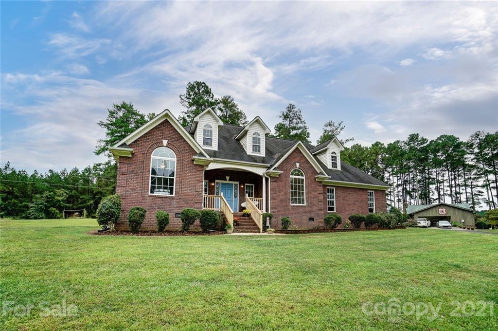 9180 Meadowood Road Mount Pleasant, NC 28124 - Photo 3 of 37 a front view of a house with garden