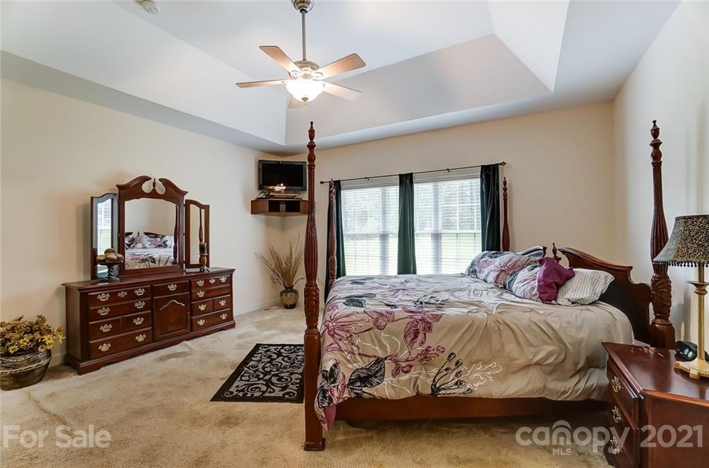 9180 Meadowood Road Mount Pleasant, NC 28124 - Photo 22 of 37 a bedroom with a bed and a dresser