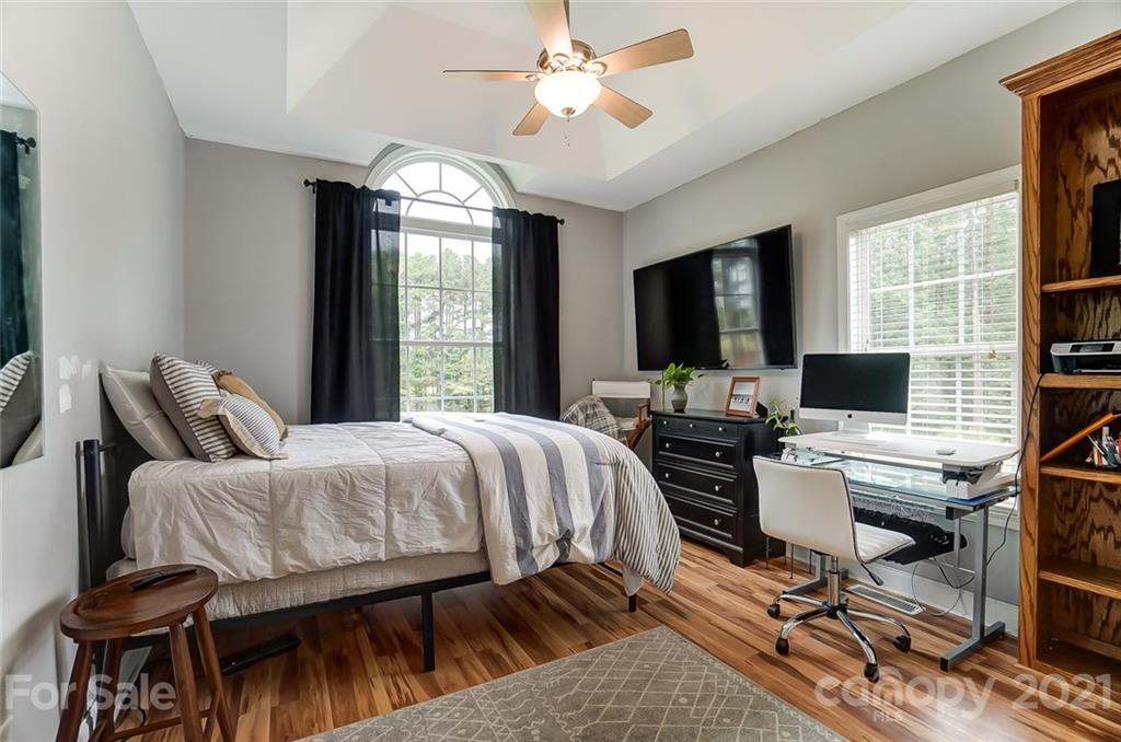 9180 Meadowood Road Mount Pleasant, NC 28124 - Photo 29 of 37 a bedroom with a bed and a flat screen tv