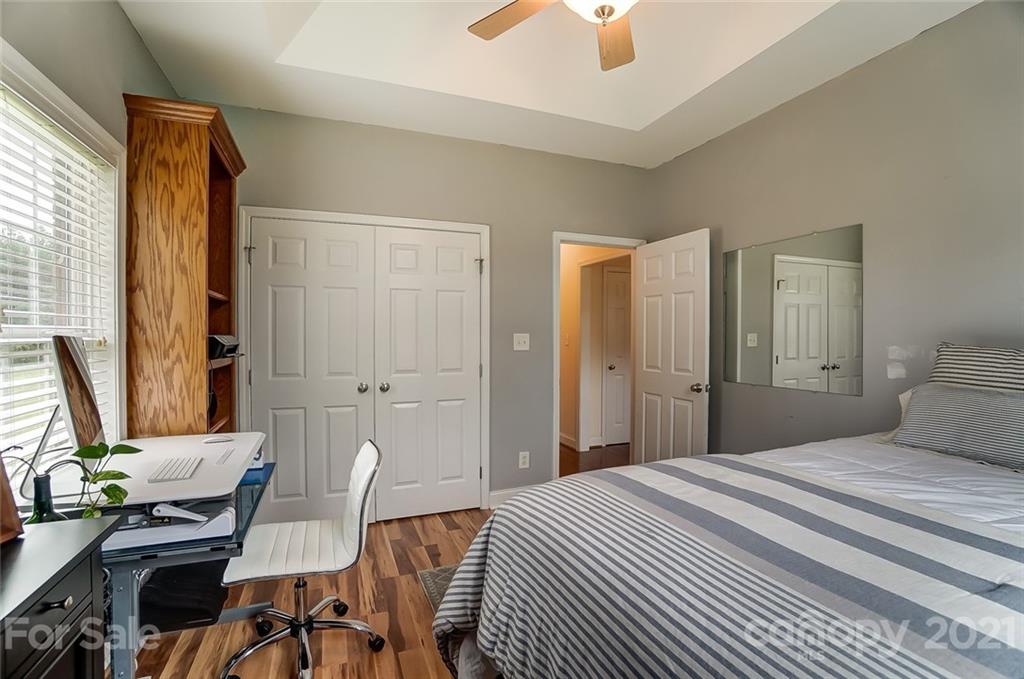 9180 Meadowood Road Mount Pleasant, NC 28124 - Photo 30 of 37 a bedroom with a bed and a window