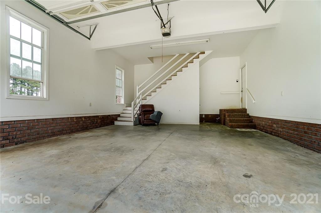 9180 Meadowood Road Mount Pleasant, NC 28124 - Photo 36 of 37 a view of a room with stairs and a window