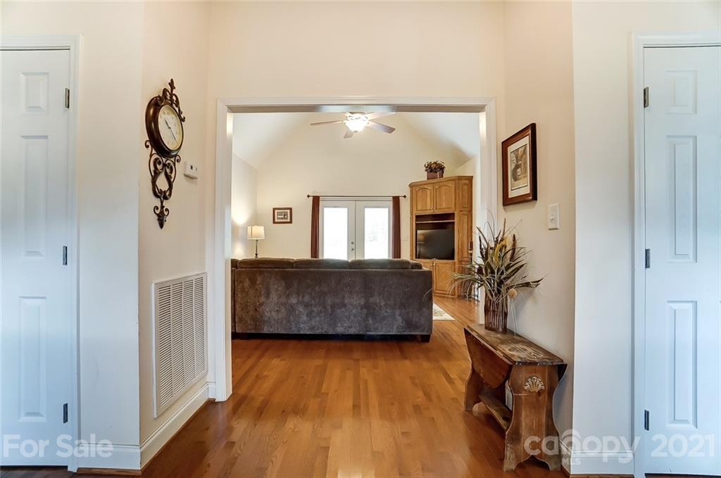 9180 Meadowood Road Mount Pleasant, NC 28124 - Photo 5 of 37 a room with wooden floor and mirror