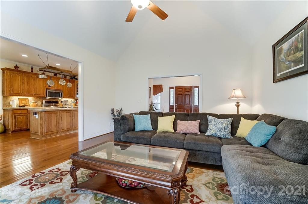 9180 Meadowood Road Mount Pleasant, NC 28124 - Photo 8 of 37 a living room with furniture and a kitchen view
