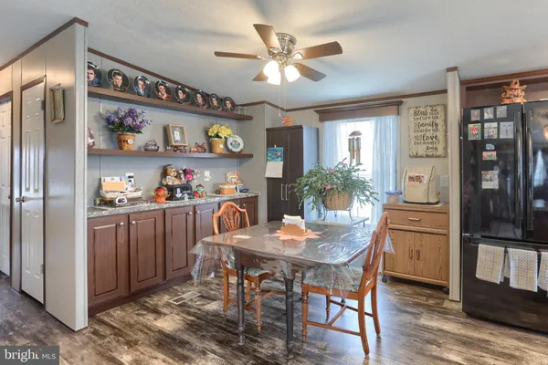 a kitchen with a dining table and chairs