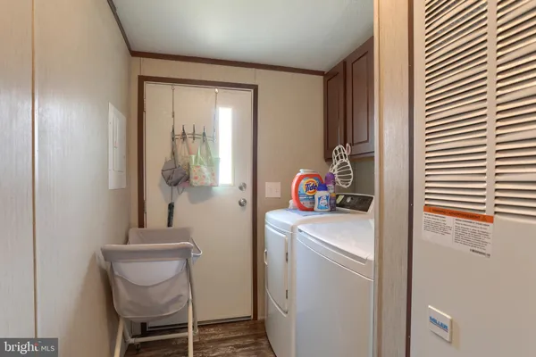 a room that has a bed and a chair in it