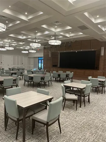 a living room with a couch and chandelier