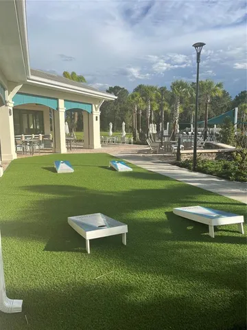 a view of a fountain in front of a house