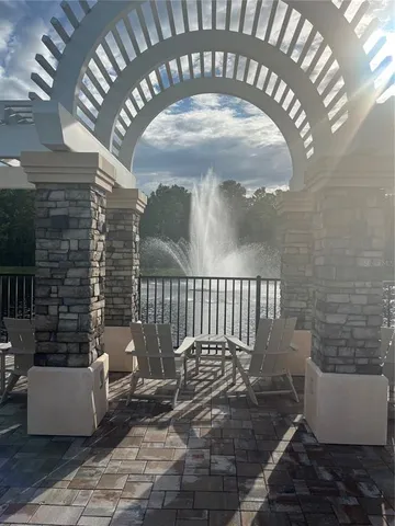 a view of a swimming pool with a yard