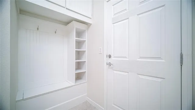 a view of a kitchen from a hallway