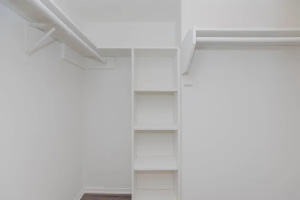 a view of an empty walk in closet