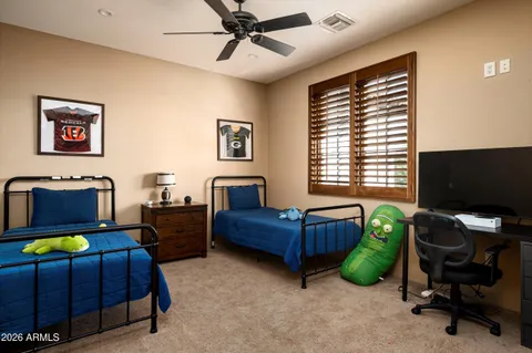 a bedroom with furniture and a window