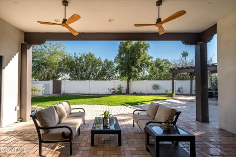 a patio with table and chairs