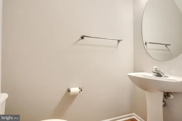 a bathroom with a sink and mirror