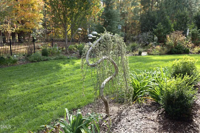 a view of balcony with wooden floor and fence