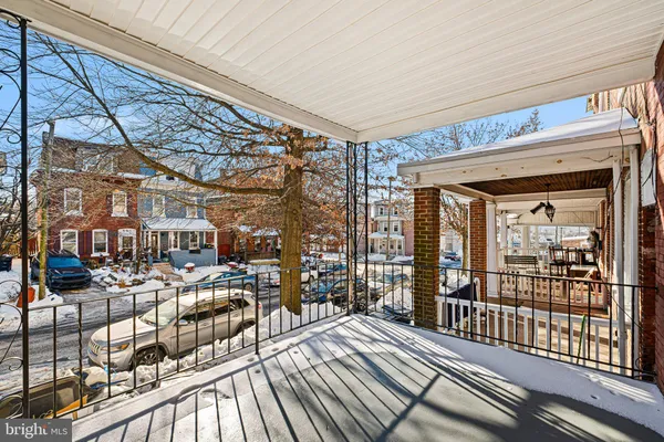 a view of a porch with wooden floor