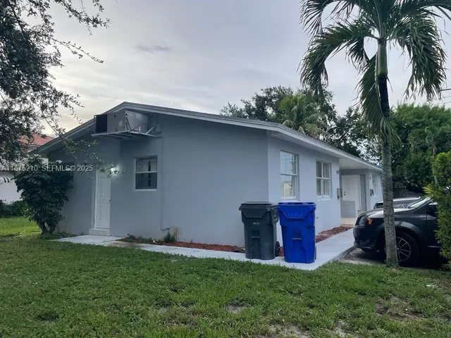 a house view with a garden space
