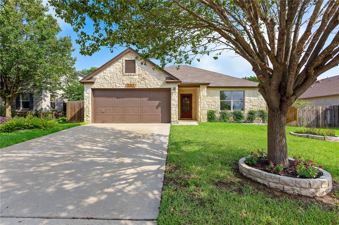 2317 Lauren Loop Leander, TX 78641 - Photo 1 of 1 a front view of house with garden
