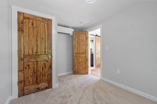 203 Taylor Road Ashby, MA 01431 - Photo 23 of 30 an empty room with wooden door