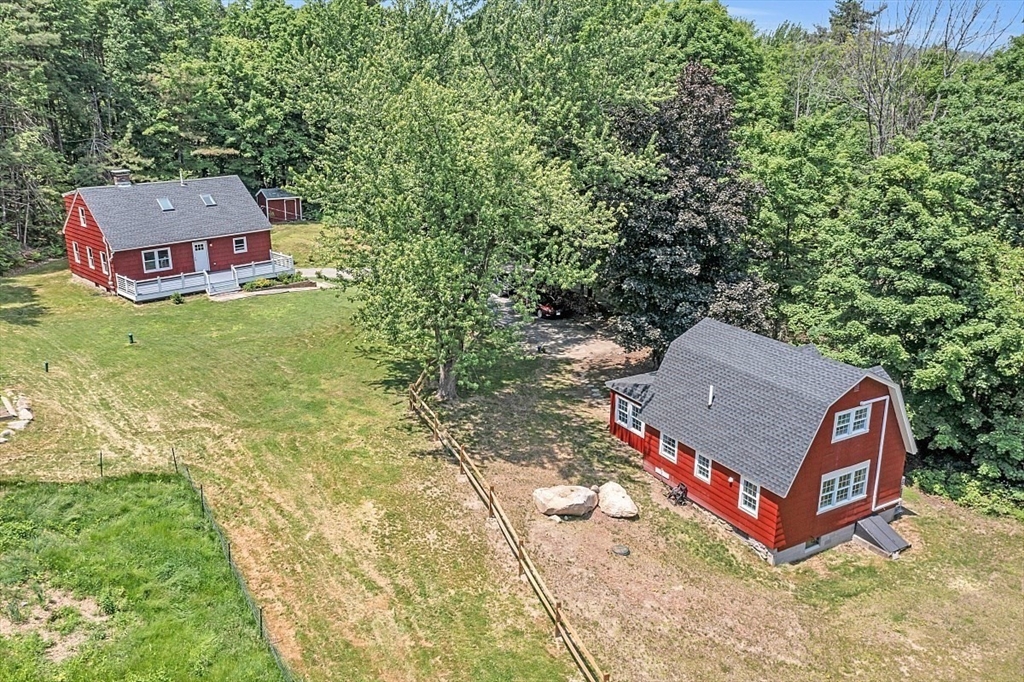 203 Taylor Road Ashby, MA 01431 - Photo 29 of 30 an aerial view of a house with swimming pool and red chairs