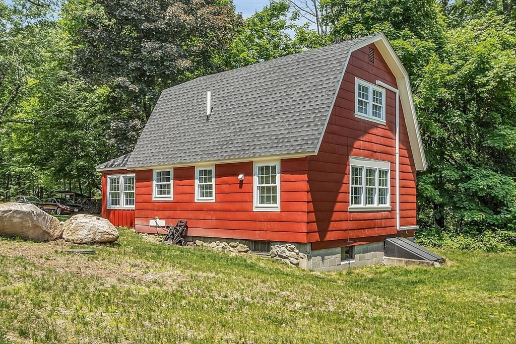 203 Taylor Road Ashby, MA 01431 - Photo 4 of 30 a front view of a house with a yard