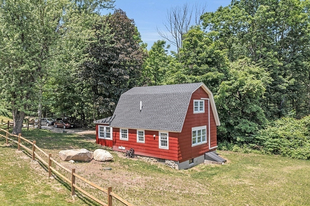 203 Taylor Road Ashby, MA 01431 - Photo 5 of 30 a view of a house with a yard