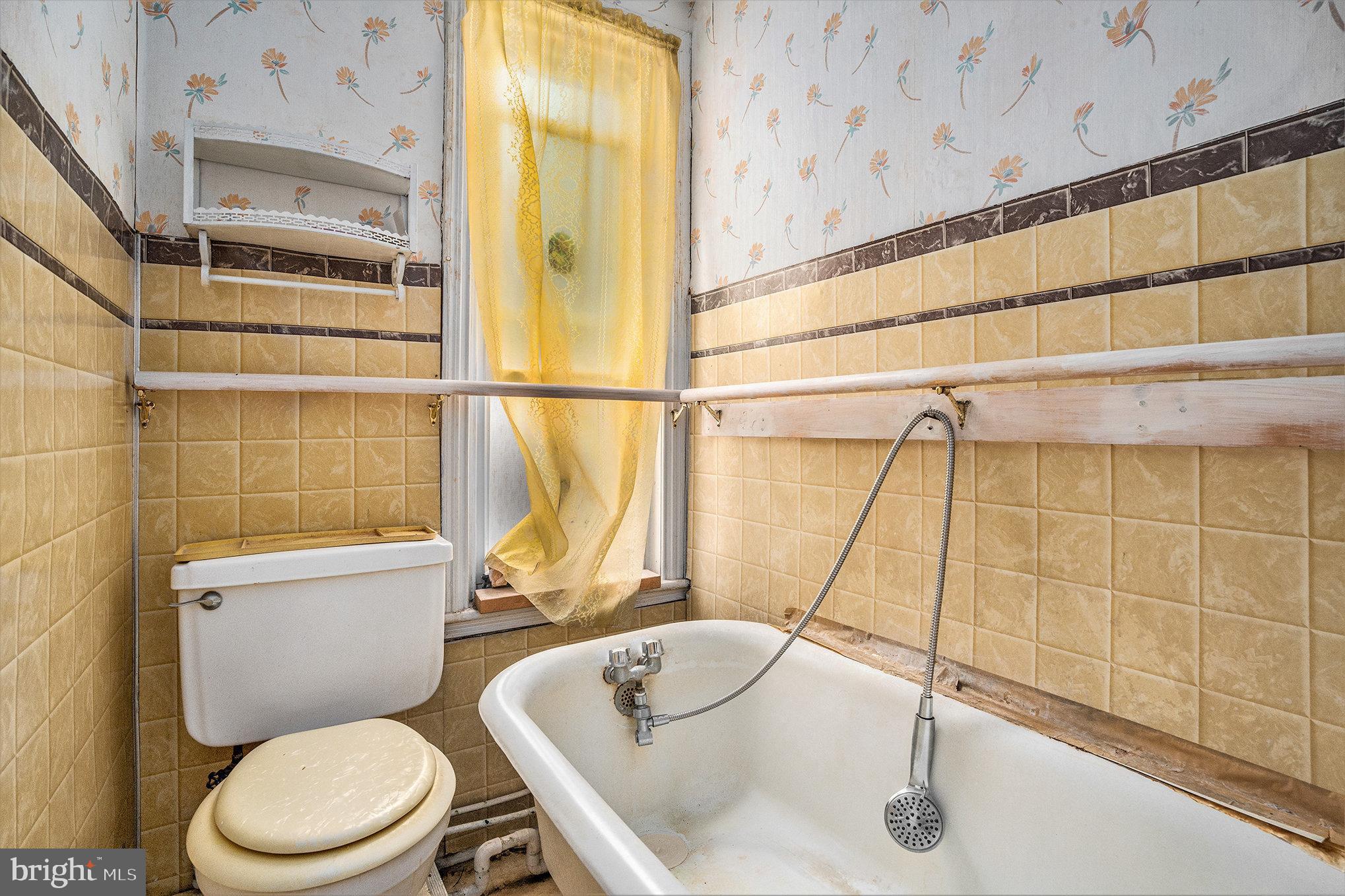 527 Christian Street Philadelphia, PA 19147 - Photo 19 of 28 a white toilet sitting next to a bathroom sink