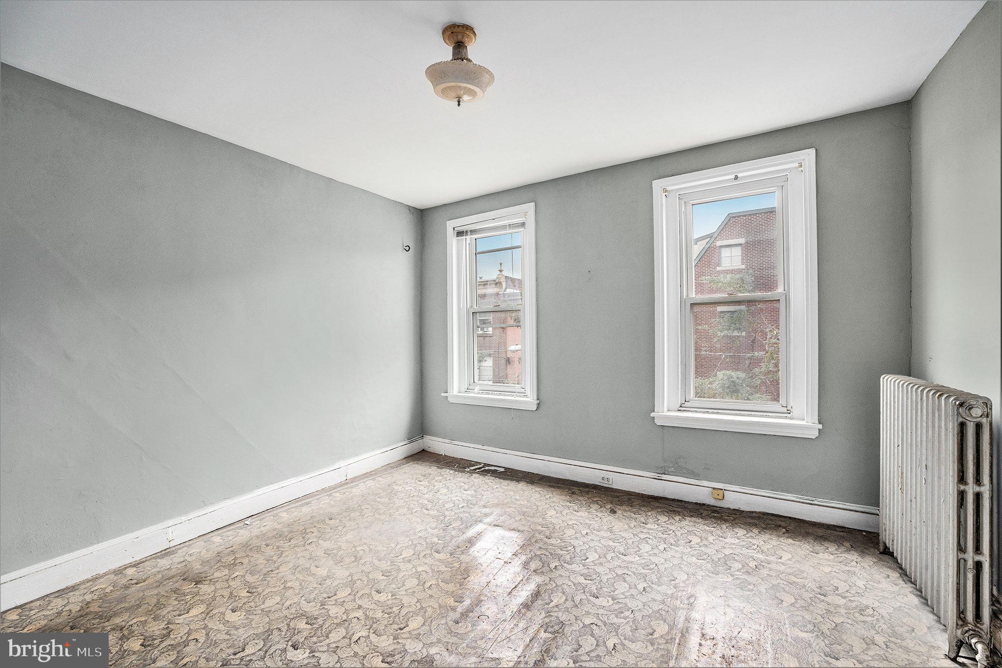 527 Christian Street Philadelphia, PA 19147 - Photo 23 of 28 a view of an empty room with a window