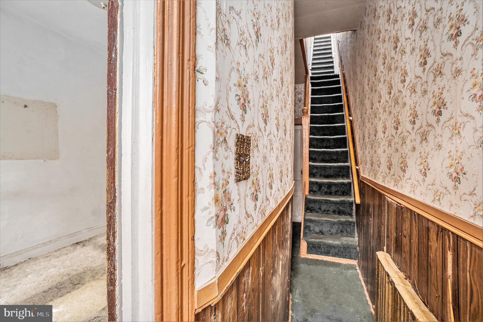 527 Christian Street Philadelphia, PA 19147 - Photo 4 of 28 a view of a hallway with wooden floor and stairs