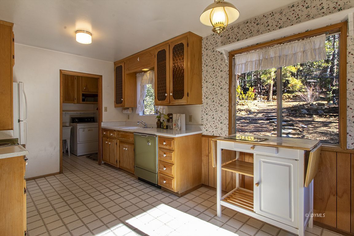 25230 Glen Road Idyllwild, CA 92549 - Photo 13 of 57 a kitchen with stainless steel appliances granite countertop a stove a sink and a microwave